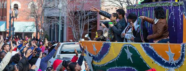 The 2013 Krewe of Harambee MLK Day Mardi Gras Parade Thowing beads